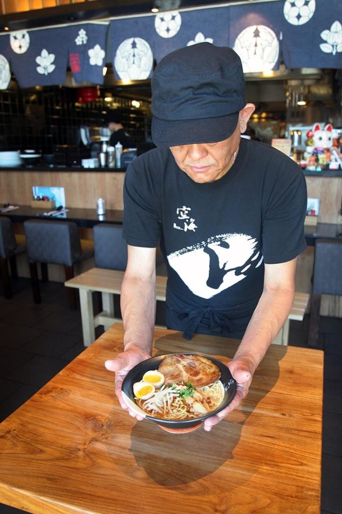 Kizuki chef presenting a bowl of ramen